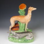 A 19thC Staffordshire Spill holder of group of two Greyhounds, possibly McGrath and Pretender, H