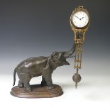 A Continental Gilt Brass and Bronzed Spelter "Mystery" Timepiece, modelled in the form of an