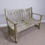 A teak 'Barlow Tyrie' English weathered two seater garden Bench, W 115.5 cm x H 85 cm x D 58 cm.