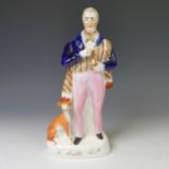 An antique Staffordshire pottery figure of Sir Walter Scott, beside a hound, decorated in colours on