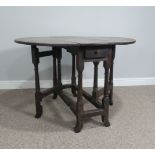 An Antique oak oval drop-leaf Table, raised on turned tapering legs and swayed feet, W 93 cn x H