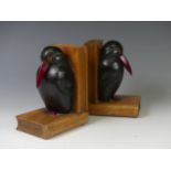 A pair of Bookends in the shape of two carved penguins, W 8 cm x H 14.5 cm x D 11 cm, together