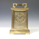 A French gilt-brass strikings and repeating Carriage Clock, of typical five-glass form, signed and