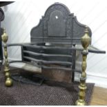 A large Regency style cast iron and brass fire Grate, having arched back, urn finials, and beaded