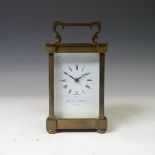 A continental gilt brass Carriage Clock, of typical five-glass form, retailed by Matthew Norman,