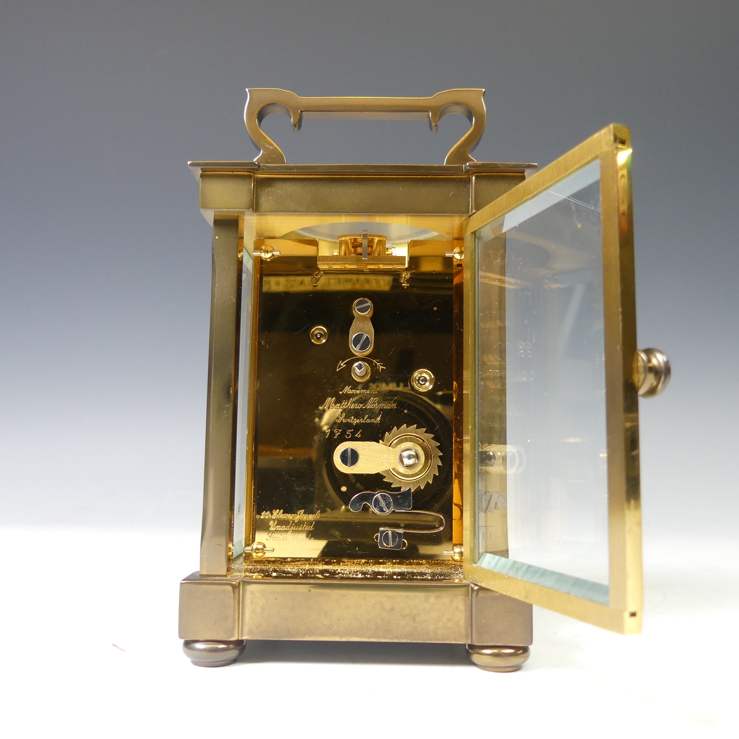 A continental gilt brass Carriage Clock, of typical five-glass form, retailed by Matthew Norman, - Image 6 of 10