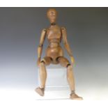 A 19thC French artist's lay figurine carved and stained beech and brass articulated joints,  stamped