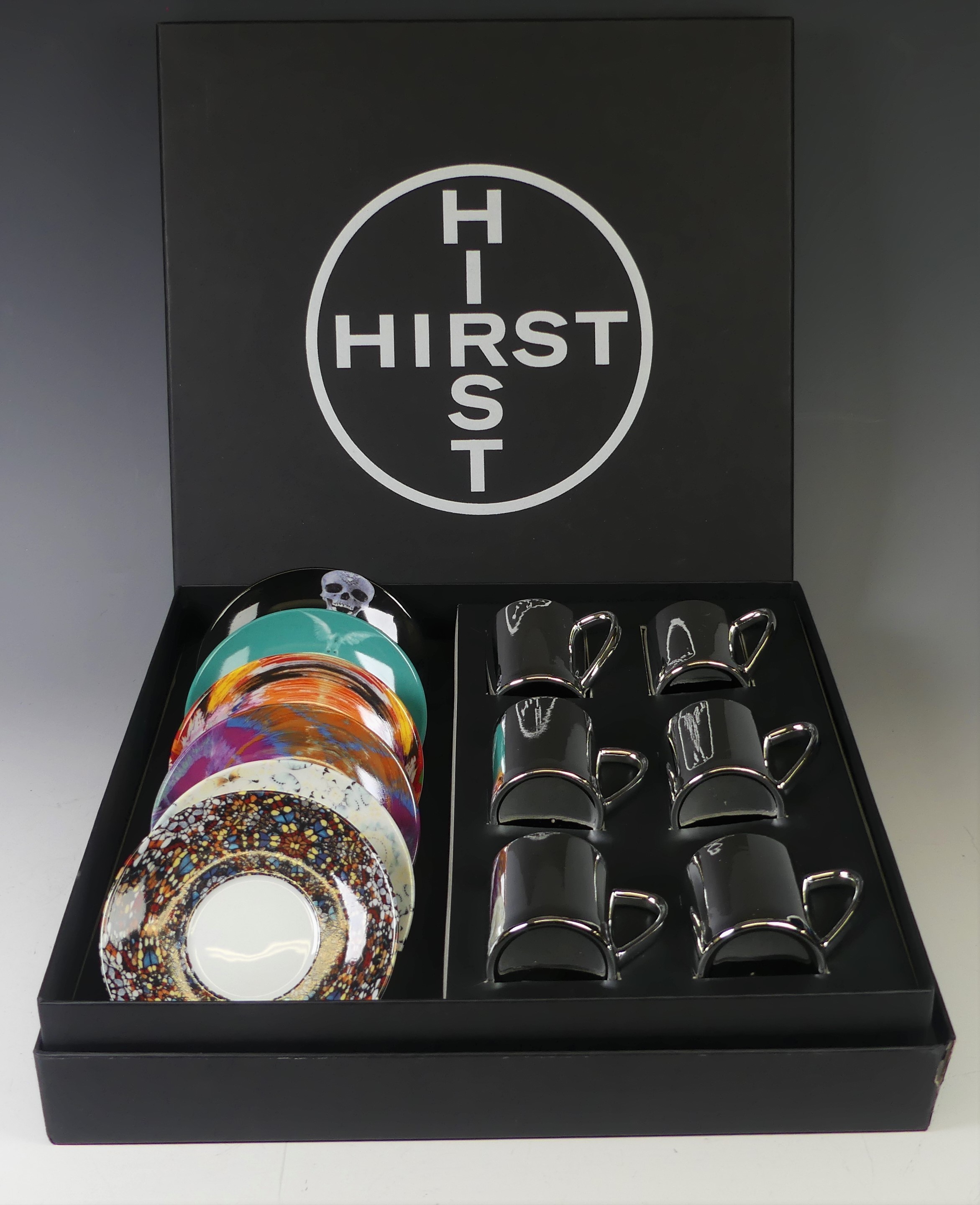 A Damien Hirst six piece anamorphic Coffee Set, comprising six silver Cups with six corresponding