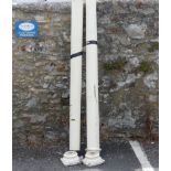 A pair of decorative wooden painted garden Pillars, with wear and tear commensurate to daily use and