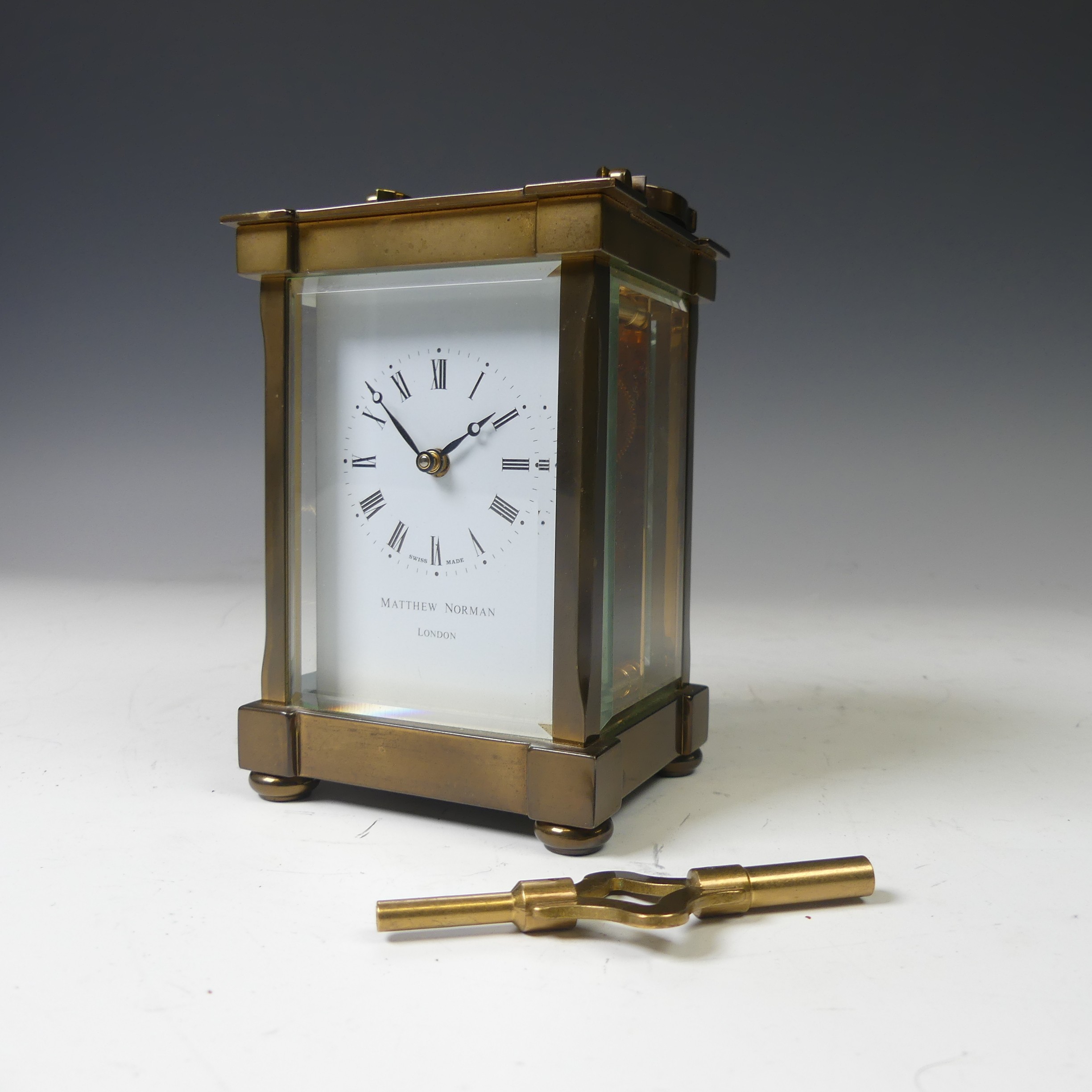 A continental gilt brass Carriage Clock, of typical five-glass form, retailed by Matthew Norman, - Image 10 of 10