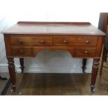 A Victorian side Table, with four drawers around a kneehole, on fluted tapering legs with casters, W