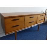 A mid 20thC teak Sideboard designed by Frank Guille for Austinsuite, formerly a dressing table, W