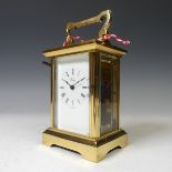 An English gilt brass Carriage Clock, of typical five-glass form. signed 'Henley' and 'Made in