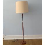 A Retro mid 20thC teak standard Lamp and shade, sold as untested, W 51 cm x H 173 cm x D 51 cm x (