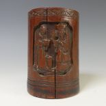 A 20thC Chinese bamboo carved Brush Pot, of cylindrical form, depicting figures in village landscape