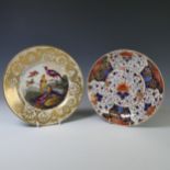 An early 19thC Crown Derby porcelain Cabinet Plate, with central decoration of five exotic birds