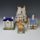 A 19thC prattware Money Box, modelled as a house, together with three other Staffordshire models