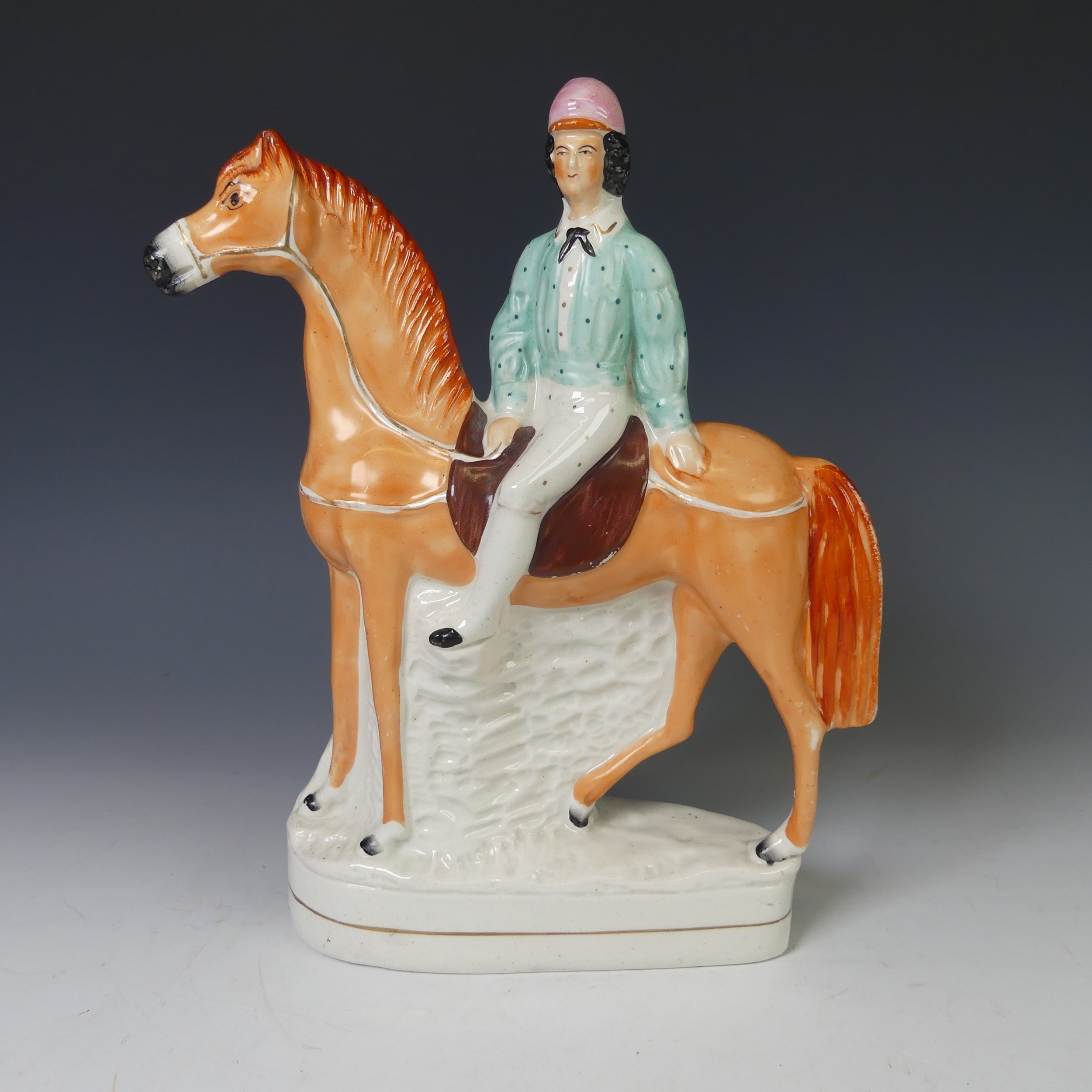 An antique Staffordshire pottery figure of a Jockey on Horseback, the rider with pink hat and blue - Image 2 of 9