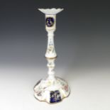 A South Staffordshire enamelled Candlestick, decorated in foliate designs in blues and gilt, with