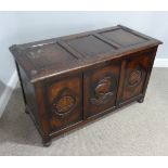 A Vintage oak three panelled Coffer, with carved decorative shell, ship, shell panels, raised on