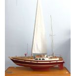 A builders scale model of the Jarrett 50' ketch 'Eirenikon' by M & L Yachts, set on large wooden