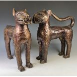 A large pair of African, Benin Leopards, patinated bronze with engraved circular design, one with