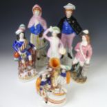 A small quantity of Staffordshire Figures, to include Spill Vase depicting children with a yacht,
