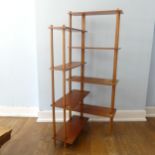 A mid-20thC Retro teak open corner Bookcase, with alternating staggered shelves, W of shelves 76