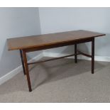 A mid-20thC teak extending dining Table, supported by tapering square legs and crinoline style