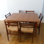 A Retro 1970s teak 'Meredew' Suite comprising of ; A 1970s teak extending dining Table and six