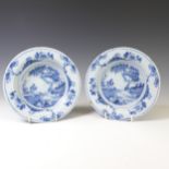 A pair of 19thC European Delftware Bowls, decorated in underglaze blue depictions in the willow