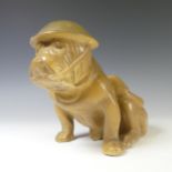 A Royal Doulton WWII British 'Tommy' Bulldog, modelled wearing helmet, chipped,  in seated position,
