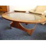 A Vintage G-Plan Astro circular coffee Table, with inset glass top, raised on shaped 'X' frame
