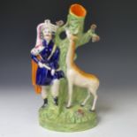 A Victorian Staffordshire pottery spill Vase, modelled as a Giraffe with its Keeper against