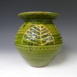 A Harry Juniper pottery Vase, the globular body with flared rim, of green ground with leaf