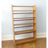 A vintage Ercol light elm graduated open Bookcase, W 82.5 cm x H 132 cm x D 23.5 cm.