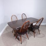 An Ercol dark wood rectangular dining Table and set of four Ercol quaker hoop back Chairs, (Table) W