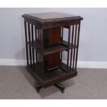 An Edwardian inlaid mahogany revolving Bookcase, with two tiers, W 48 cm x H 90 cm x D 48 cm.