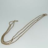 A triple row 9ct gold Chain, joined at one end by a small O ring, the other ends loose, one with