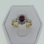 A small garnet and white sapphire Cluster Ring, mounted in 18ct yellow and white gold, Size M, 2.4g