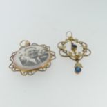 An Edwardian 9ct gold Pendant, of open foliate form set blue pastes and seed pearls, 4.7cm long, 1.