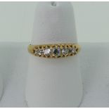 A graduated five stone diamond Ring, the centre stone approx. 0.14ct, all mounted in unmarked yellow