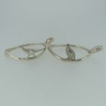 A pair of Elizabeth II novelty silver Napkin Rings, hallmarked Birmingham 1975, in the form of