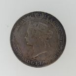 An 1866 Hong Kong Dollar, the obverse with Victoria diademed head, the reverse with date and