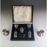 A cased George V silver five piece Cruet Set, by Adie Brothers Ltd., hallmarked Birmingham 1933 (two