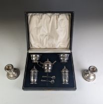 A cased George V silver five piece Cruet Set, by Adie Brothers Ltd., hallmarked Birmingham 1933 (two