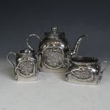 An early 20thC Chinese export silver three piece Tea Set, of cube form with rounded shoulders,