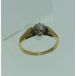 A single stone diamond Ring, the circular stone approx. 0.15ct, claw set in 9ct yellow gold, Size I,