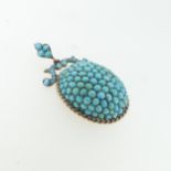 A 19thC turquoise Pendant, of oval form with ropetwist border, scrolling surmount and suspension