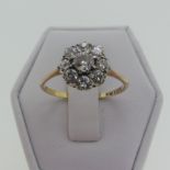 A diamond cluster Ring, formed of old cut stones, the centre approx. 0.19ct, surrounded by eight